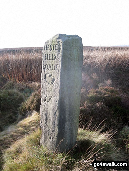 Ancient Guide Stoop/Sign Post on Beeley Lane near Harland Sick The left face says 'CHESTER FIELD ROADE' with a hand pointing the way, the right face says 'CHATSW ORTH ROADE' with a similar hand pointing the way