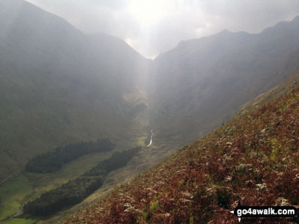 Rays of sun shining through the clouds over Fairfield (left) and Dollywaggon Pike (right) and Grisedale from Brownend Plantation