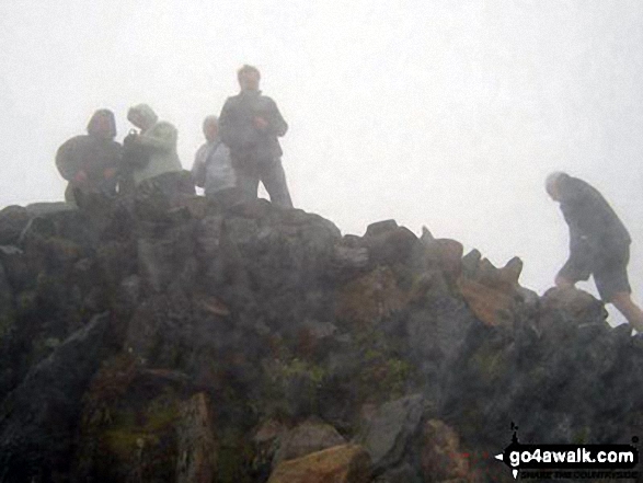 My husband on the summit of Snowdon Not much of a view though