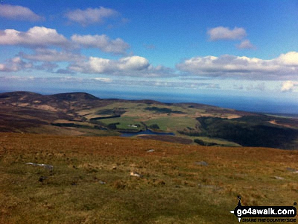 The view from the top of Snaefell From the top you can see all of the island, Wales, Scotland, Ireland and England. Simply stunning panorama.