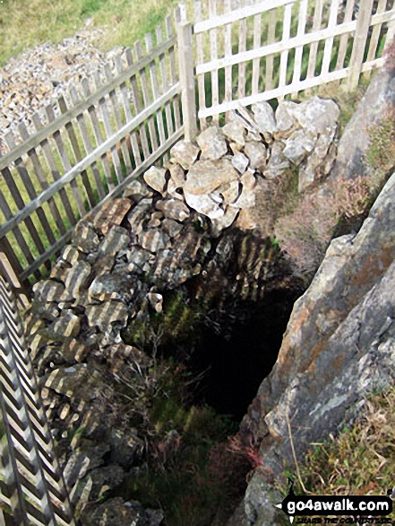 Fenced of mine shaft beneath Bryn Bedwog on the lower slopes of Y Garn (Rhinogs)