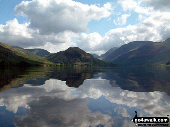 The shoulder of Grasmoor (left), Robinson, Rannerdale Knotts (centre) and the High Stile Ridge (High Crag, High Stile and Red Pike (Buttermere) reflected beautifully in a very still Crummock Water taken from the north west shore below Mellbreak