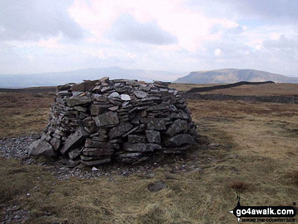 Fountains Fell summit cairn with Pen-y-ghent in the background 