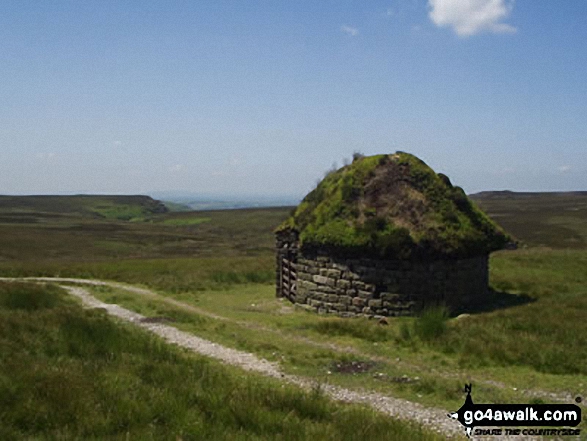 Shooters cabin on Embsay Moor looking over Lower Barden Reservoir to Simon's Seat 