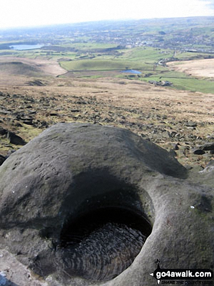 Hollingworth Lake from a stone hollowed out by the weather on Blackstone Edge summit 