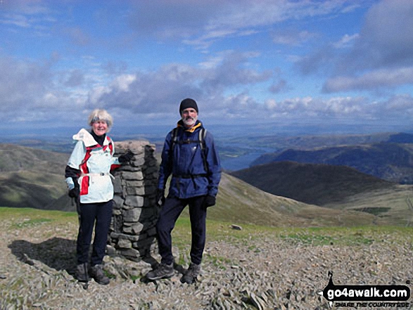 Walk c432 Helvellyn from Thirlmere - Anthea and Graham on Helvellyn summit with Ullswater in the distance