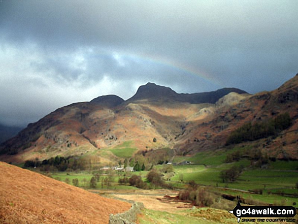 Walk c238 Lingmoor Fell and Great Langdale from Elterwater - Approaching the (somewhat moody) Langdale Pikes along the Cumbria Wayin Great Langdale below Oakhowe Crag.