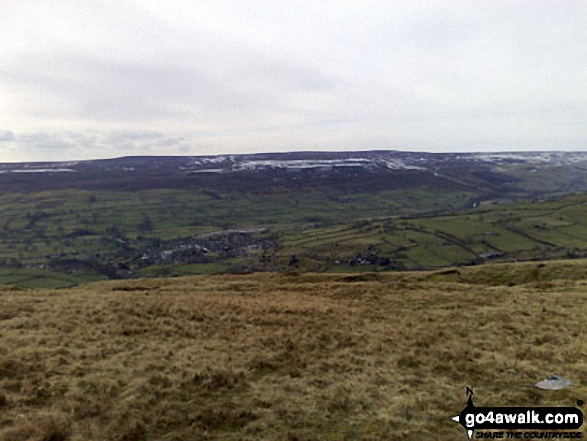 Walk ny221 Fremington Edge and Arkengarthdale from Reeth - Gibbon Hill and Harkerside Moor with Reeth in the valley below from Fremington Edge