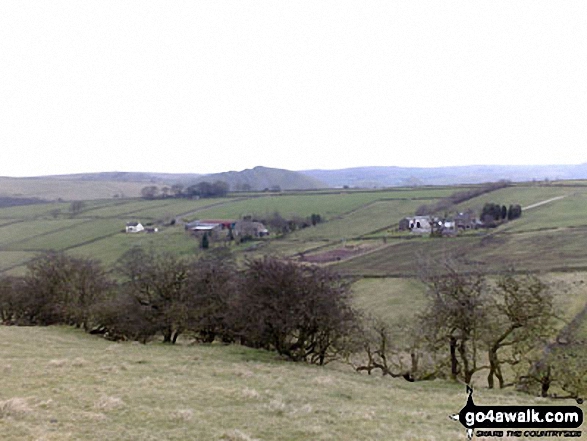 Walk s185 Hollinsclough and Earl Sterndale from Longnor - The distinctive outline of Chrome Hill in the distance, just north of the village of Hollinsclough. Taken from footpath between Hill Top Farm and Wilshaw (Moseley)