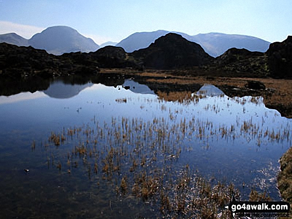 Innominate Tarn, Hay Stacks with Great Gable,  Kirk Fell and Scafell Pike in the distance