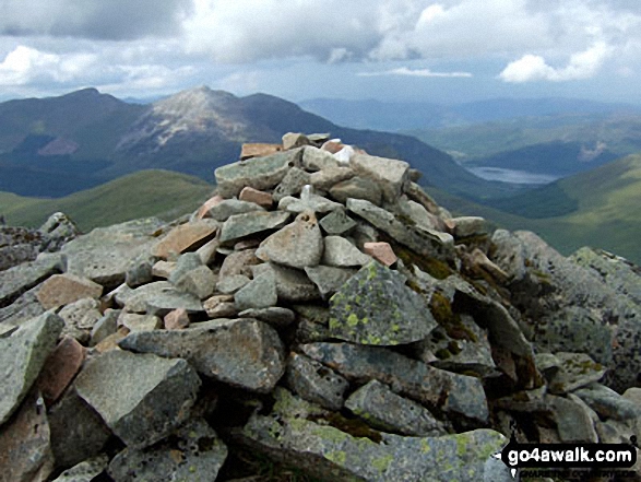 Sgor na h-Ulaidh summit cairn with Sgorr Dhonuill (Beinn a' Bheithir), Sgorr Dhearg (Beinn a' Bheithir) and Loch Leven un the background 