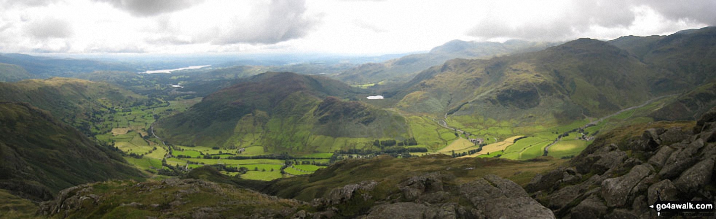 Blea Rigg, Castle How, Lang How and Silver How (far left) Great Langdale, Windermere and Elter Water (left), Lingmoor Fell and Side Pike (centre left), Blea Tarn and Little Langdale (centre right), Pike of Blisco (Pike o' Blisco) right and Crickle Crags (far right) from the summit of Harrison Stickle, The Langdale Pikes