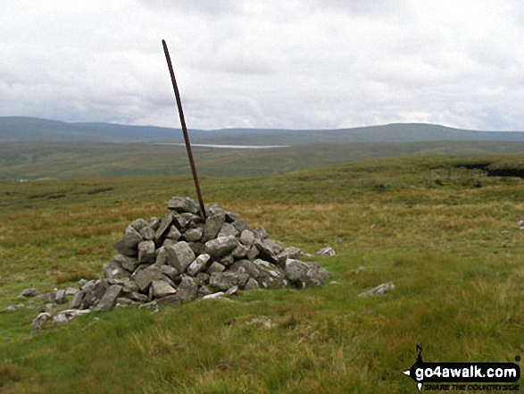 Cairn near Tarn Hole Edge with Cow Green Reservoir in the distance 