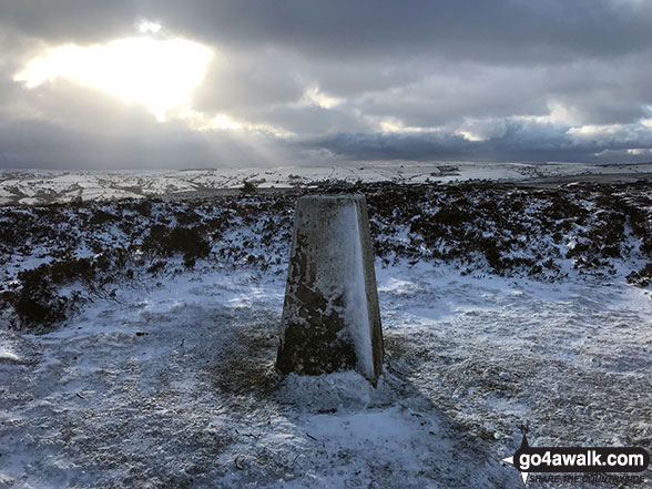 Snow on the summit trig point on Revidge