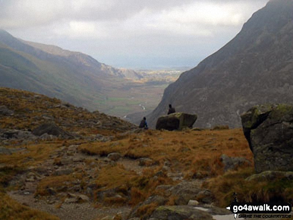 Walk gw187 Y Garn (Glyderau),  Glyder Fawr, Castell y Gwynt and Glyder Fach from Ogwen Cottage, Llyn Ogwen - Looking down Nant Ffrancon to Bethesda with Anglesey in the far distance from near Llyn Bochlwyd in the Ogwen valley