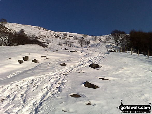 Walk d212 Alport Castles from Fairholmes Car Park, Ladybower Reservoir - Looking back up to Alport Castles from Alport Dale in the snow