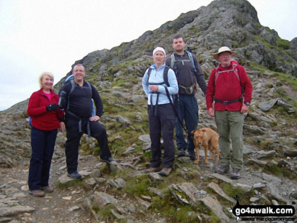 Family group having completed Striding Edge before the last pull up to Helvellyn.