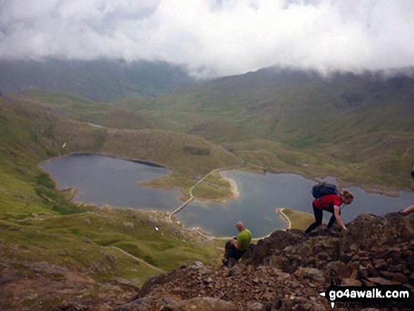 Walk gw136 The Snowdon (Yr Wyddfa) Horseshoe from Pen y Pass - Scrambling up towards Crib Goch with Llyn Llydaw far below