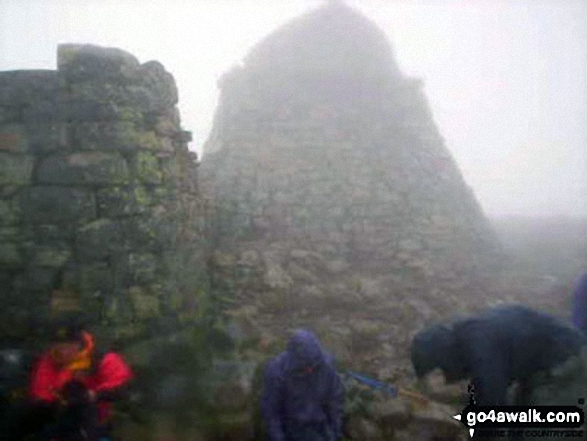 A group of us (Dave, Jean, Jeff & myself) arriving at the summit of Ben Nevis So wet, so cold and no views. Didn't linger long.