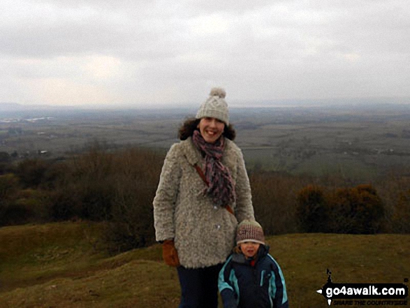 Me and a friends little girl attempting a wee picnic up Haresfield Beacon Us walkers are made of tough stuff! Even the little ones are too. It was supposed to be spring but it was minus temperatures. Needless to say the little one was determined to sit down - but what a view. A small hill but enough for children and great place in the summer.