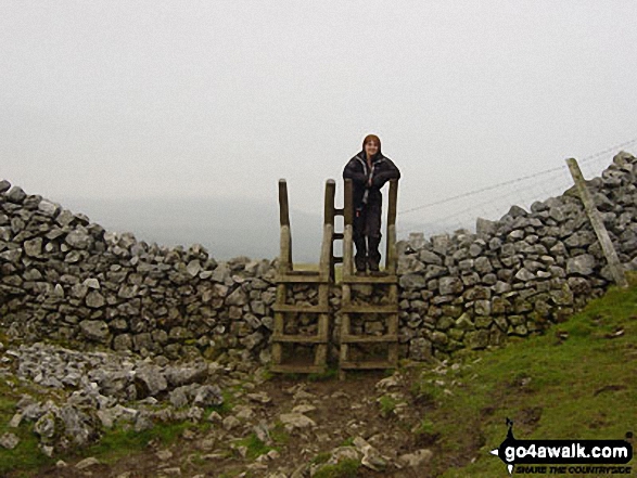 Walk ny101 The Yorkshire Three Peaks from Horton in Ribblesdale - The final stile in Horton in Ribblesdale at the end of the Yorkshire Three Peaks of Challenge Walk