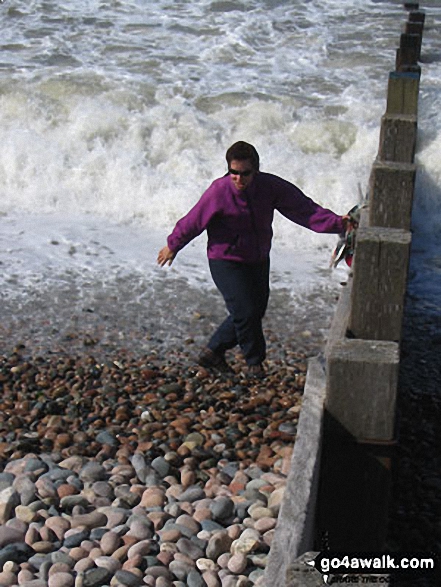 Collecting the traditional pebble (and getting soaked in the process!), St Bees 