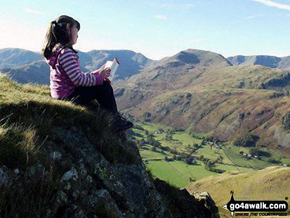 Walk c155 The Knott and Place Fell from Patterdale - My daughter taking in the wise words of Wainwright on Angletarn Pikes