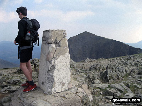 Walk gw186 Garnedd Ugain, Snowdon (Yr Wyddfa) & Moel Cynghorion from Llanberis - Roman on the summit of Garnedd Ugain (Crib y Ddysgl) with (the now conquered) Mount Snowdon in the background.