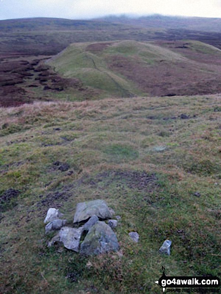 The cairn on Bullman Hills (South Top) summit with Bullman Hills and Cross Fell beyond 