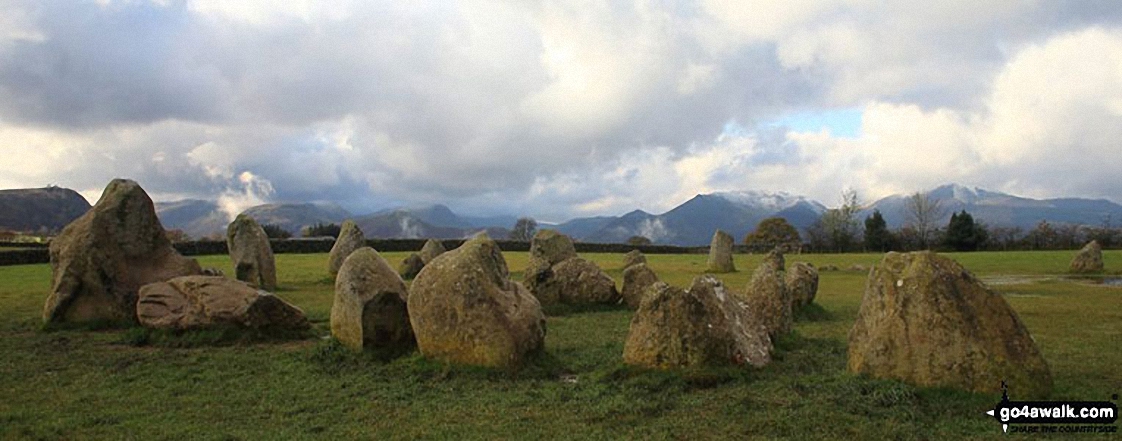 Walk c126 Castlerigg and Threlkeld from Keswick - Castlerigg Stone Circle with the shoulder of Walla Crag (left), Maiden Moor, Cat Bells (Catbells), Sail, Causey Pike, Barrow and Grisedale Pike in the background