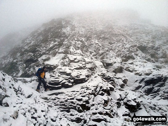 Walk c117 Blencathra and Knowe Crags (Blease Fell) via Sharp Edge from Scales - My mate Rich just strolling past the 'Bad Step' on Sharp Edge  without really noticing it!