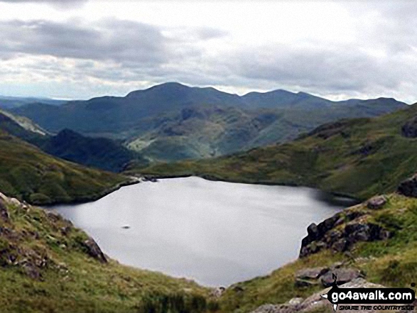 Stickle Tarn from the slopes of Pavey Ark with Pike of Blisco (Pike o' Blisco) and The Coniston Fells in the distance August, 2013