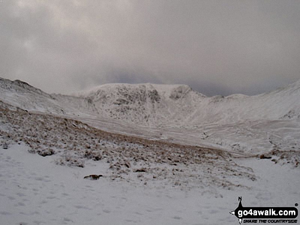 Walk c224 Helvellyn via Swirral Edge and Raise from Glenridding - Helvellyn Summit flanked by Striding Edge (left) and Swirral Edge (right) from Hole-in-the-Wall in the snow