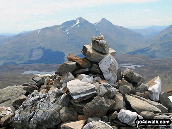 Beinn Challum (South Top) summit cairn with Ben More and Stob Binnein in the distance 