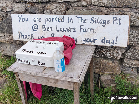 Honesty box for parking in The Silage Pit at Ben Lawers Farm on the north western side of Loch Tay