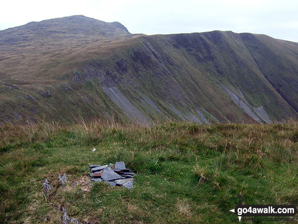 The small pile of stones on the summit of Gwaun y Llwyni with Aran Fawddwy (left) and Drysgol (right) beyond 