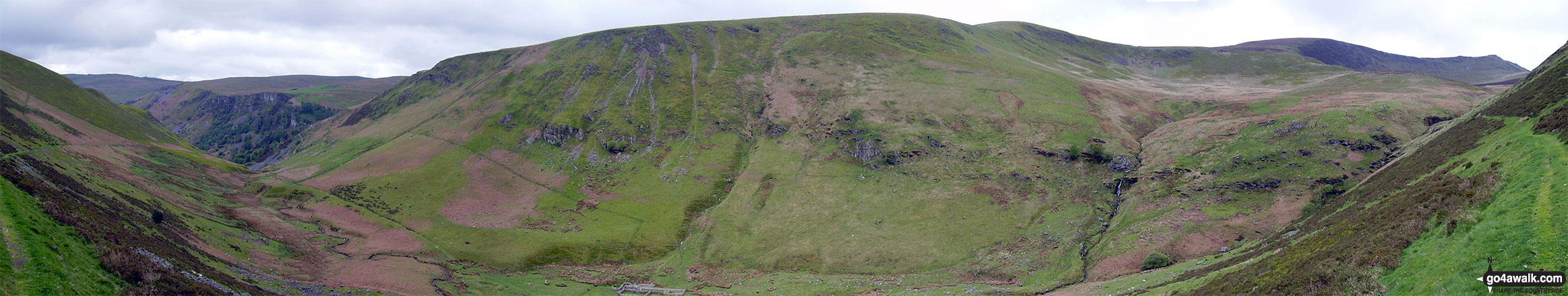 Walk po142 Cadair Berwyn from Pistyll Rhaeadr - The Pistyll Rhaeadr crags (far left), Trum Fellen, Moel Sych, Cadair Berwyn and Cadair Berwyn (North Top) (far right) from Nant y Llyn near Llyn Lluncaws