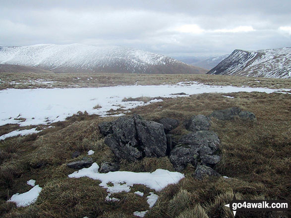 Walk c321 Skiddaw and Lonscale Fell from Millbeck, nr Keswick - The rocky summit of Sale How (Skiddaw) in the snow with Bowscale Fell (left) and Blencathra or Saddleback with Sharp Edge clearly visible (right) on the horizon