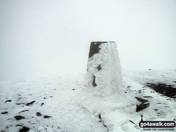 Walk c236 Skiddaw from Millbeck, nr Keswick - The trig point on the summit of a very cold and snowy Skiddaw