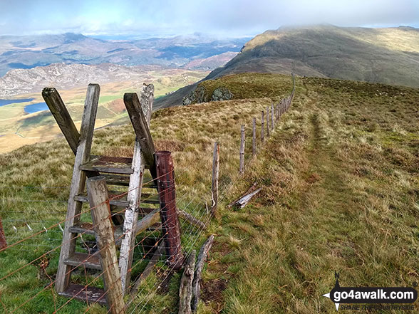 Ladder stile on the summit of Tyrrau Mawr (Craig-las) with Cyfrwy (The Saddle) and Cadair Idris (Penygadair) in the background 