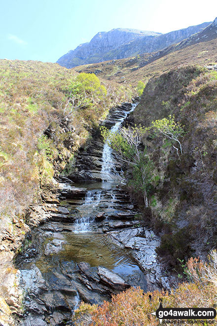 Waterfalls above Muiseal on the lower slopes of Ben Hope with Ben Hope itself towering above in the background 