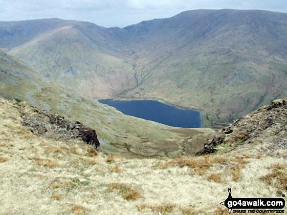 Walk c332 The Hagg Gill Round from Troutbeck - Mardale Ill Bell (left) Nan Bield Pass and Harter Fell (Mardale)(right) with Kentmere Reservoir below from the summit of Yoke