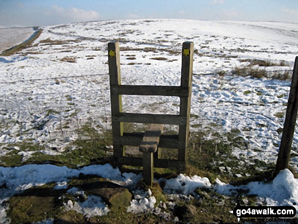 Walk ch310 West Parkgate, Sponds Hill and The Cage from Lyme Park Country Park - Stile on Dale Top in the snow