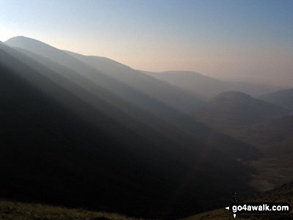 Walk c231 Stony Cove Pike (Caudale Moor) and Gray Crag (Hayeswater) from Hartsop - View from Threshthwaite Crag below Stony Cove Pike (Caudale Moor) with the sun just breaking from behind Thorthwaite Crag