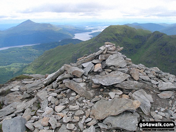 Walk ab124 Ben Vane from Inveruglas - Ben Vane summit cairn with Beinn Narnain beyond and Ben Lomond and Ptarmigan in the distance across Loch Lomond