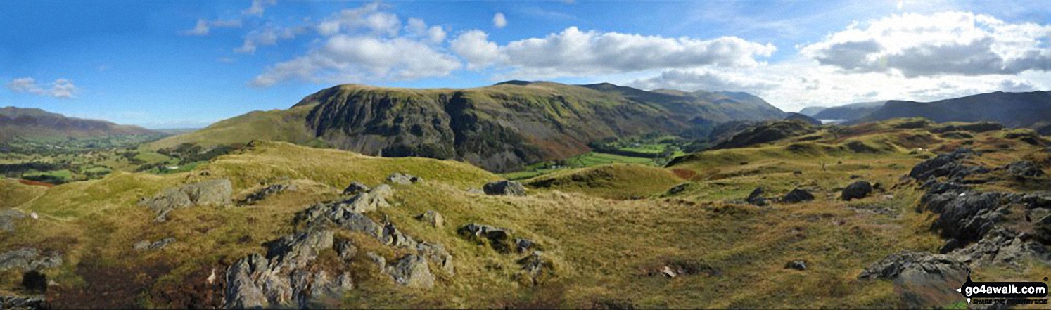 Blencathra or Saddleback (left), Clough Head, Fisher's Wife's Rake, Calfhow Pike, Great Dodd, Watson's Dodd, Stybarrow Dodd, Raise (Helvellyn) and Helvellyn in the centre with a glimpse of Thirlmere (right) from the summit of High Rigg