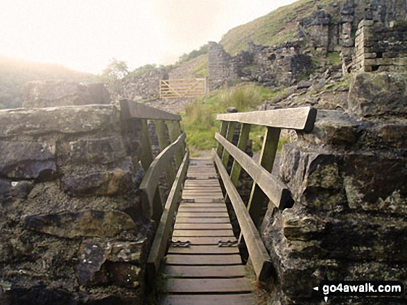 Walk ny103 Rogan's Seat and Water Crag (Arkengarthdale) from Keld - The footbridge carrying The Coast to Coast walk over Swinner Gill near Keld