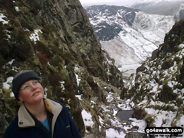 Alsion on Whitegill Crag with a snow clad Great Langdale in the background