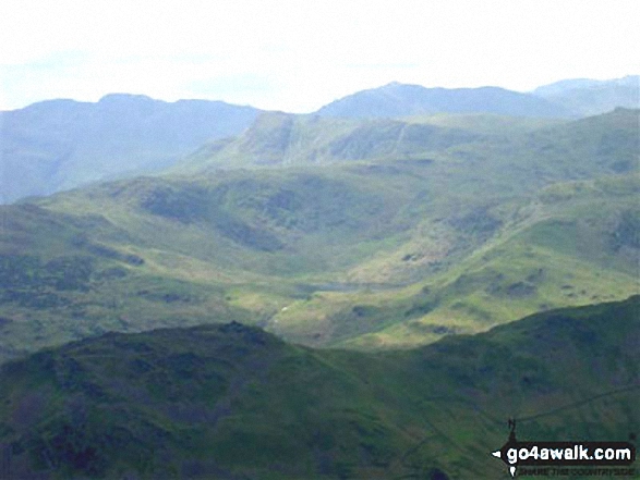 Easedale Tarn and High Raise (Langdale) with Bow Fell (Bowfell), Gunson Knott, Crinkle Crags (Long Top) and Crinkle Crags (South Top) beyond from Fairfield