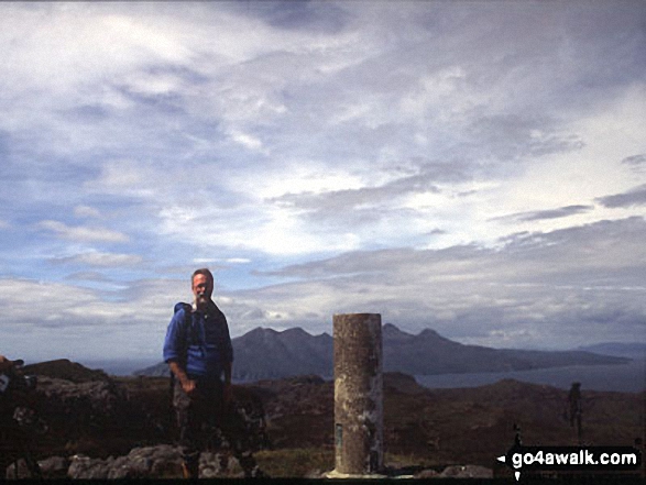 On the summit of An Sgurr (Eigg) with Rhum in the background 